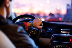 man wearing watch driving